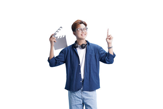 Lights, Camera, Action: A content creator holds a clapperboard and points upward, filled with creativity, enthusiasm, and vision, ready to capture the magic of the moment.