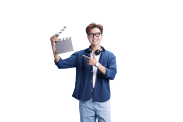 Lights, Camera, Action: A content creator holds a clapperboard with headphones around his neck, pointing towards it. He is ready to bring a fresh creative vision into existence