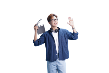 Action in Frame: An Asian man, smiles and waves while holding a clapperboard, he wears glasses and casual clothes. Ready to action.