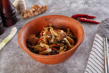 Asian cuisine udon with chicken and vegetables