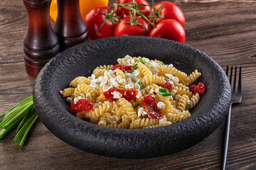 Italian pasta fusili with curd
