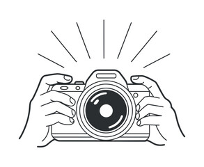 Hands holding camera with lens and details