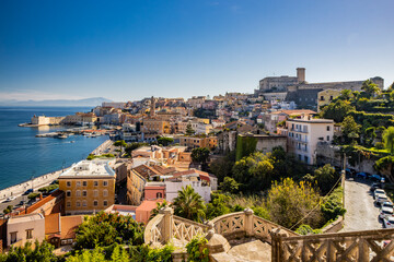 Obraz premium Gaeta, Latina, Lazio, Italy. A splendid view of the city. The ancient village with its houses overlooking the sea, seen from the top. The Angevin Castle at the top. The harbor with its moored boats.
