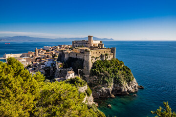 Naklejka premium Gaeta, Latina, Lazio, Italy. A splendid view of the city from the top of Monte Orlando. The imposing Angevin-Aragonese castle dominates the ancient village overlooking the sea from the clifftop.