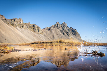 Vestrahorn rises 454 meters from the black sand coast, a basalt and gabbro formation shaped by glacial and marine erosion in Iceland&rsquo;s southeast.