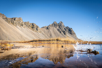 Vestrahorn rises 454 meters from the black sand coast, a basalt and gabbro formation shaped by glacial and marine erosion in Iceland&rsquo;s southeast.