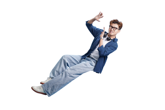 Defying Gravity: An individual floats playfully in mid-air, hands gesturing with a smile, showcasing a lighthearted and carefree attitude.