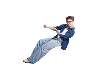 Young Man in Dynamic Pose: A young man embodies energy, joy, and drive, pulling an invisible rope in a studio setting. Captured against a clear backdrop.