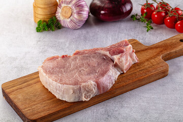 Raw pork steak with bone