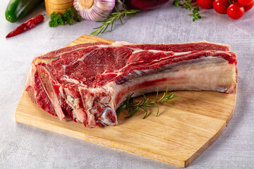 Raw prime beef steak with bone