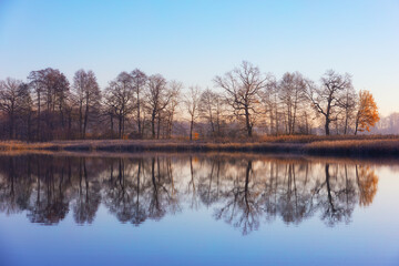 Serene Autumn Lake Reflection at Golden Hour (Poland), nature background or wallpaper