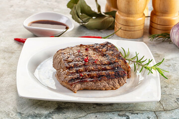 Grilled juicy beef steak with pepper