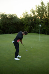 Golfer Practicing His Swing in the Golden Hour