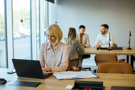 Professional meeting taking place in a modern office with focused team dynamics
