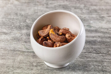Unpeeled cashew nuts in the bowl