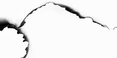 hole in a white paper. burnt holes in a paper. 