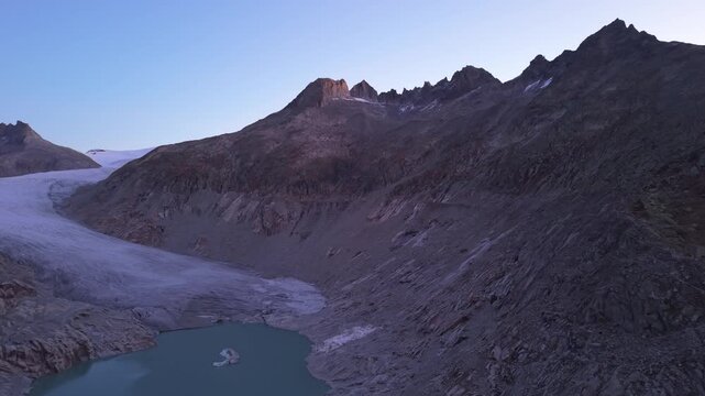 Sunrise drone shot over Rhonegletscher, iconic glacier in Switzerland.