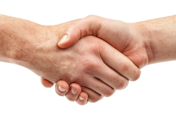 Close-up of two hands shaking.  A firm handshake against a black background.  Skin tones are light tan