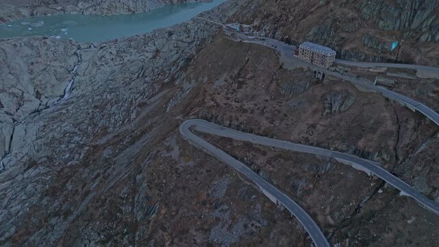 Scenic aerial of Rhonegletscher near Furka Pass during sunrise light.