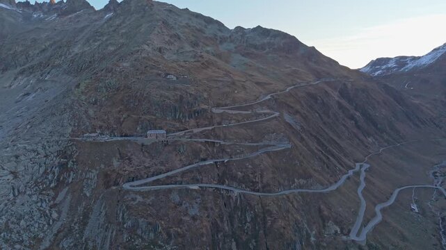 Drone shot of Switzerland&rsquo;s Furka Pass winding through the Swiss Alps.