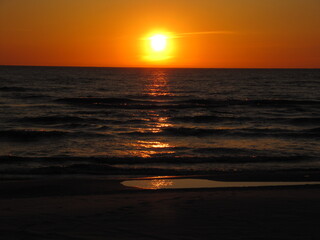 Golden Sunset Reflected on Gentle Ocean Waves