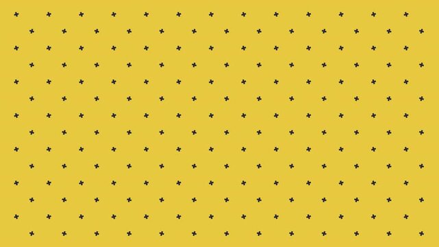 Yellow background with many small dark dots arranged in a grid pattern.