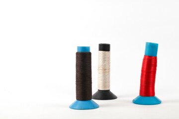 Colorful spools of thread offer a playful, vibrant crafting inspiration for sewing and creative projects that add a unique, handmade touch to designs