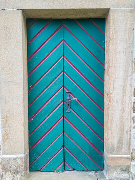 Old wooden door with colourful paint