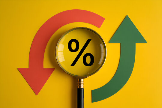 Percentage sign under magnifying glass with red down arrow and green up arrow on yellow background representing financial analysis and market trends investment and growth