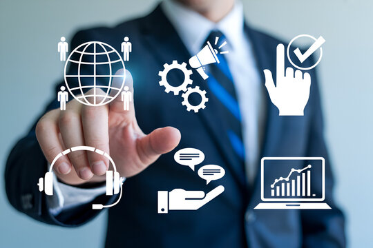 Businessman interacts with digital icons representing global communication marketing automation customer service and data analytics showcasing modern business solutions and technology integration