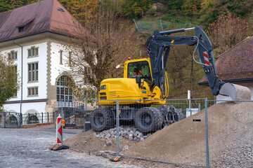 Yellow excavator on construction site. excavator loader machine during parked outdoors at construction site