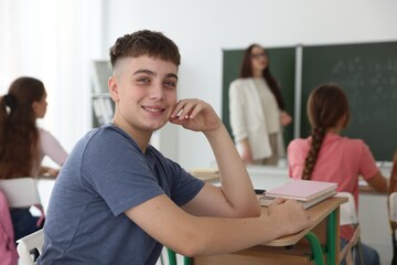 Obraz premium Teacher and students during lesson in classroom, selective focus