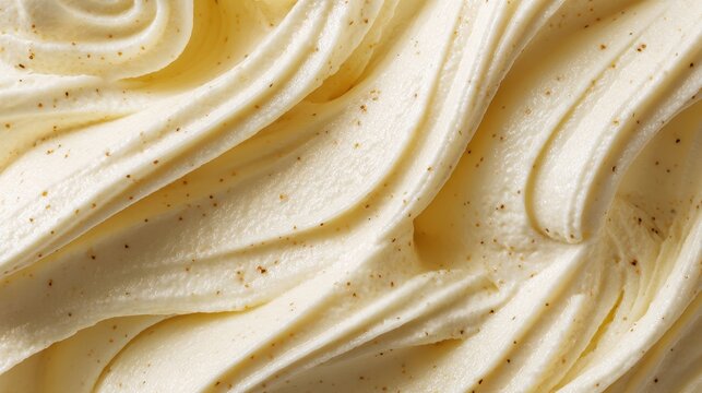 Close up of a swirl of delicious vanilla ice cream with vanilla bean specks