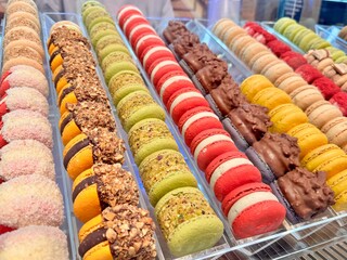 delicious dessert for tea colorful macaroons in the shop window. High quality photo