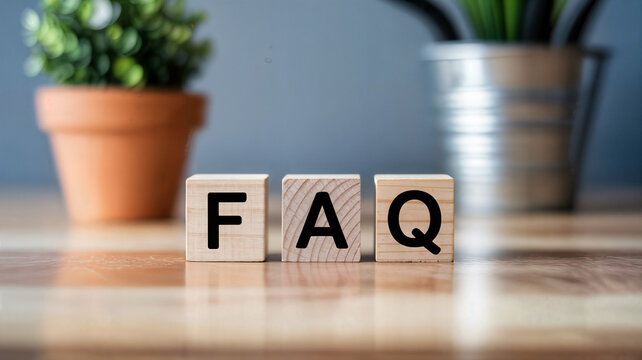 Wooden blocks spelling faq on a wooden surface with plants in the background ideal for websites blogs and articles about frequently asked questions and customer support resources