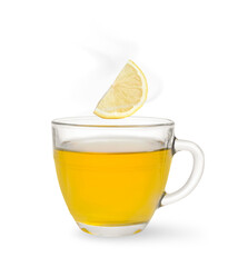 Citrus drink for health boosting. Lemon piece falling into cup on white background. Cold season remedy