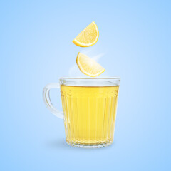Citrus drink for health boosting. Lemon pieces falling into cup on light blue background. Cold season remedy