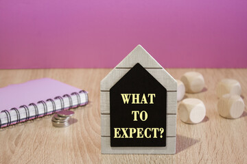 What to Expect symbol. Concept words What to Expect on a black board. Beautiful purple background....