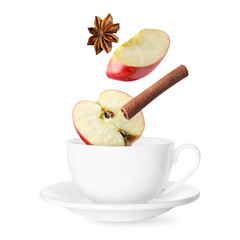 Health boosting drink for cold season. Apple pieces, cinnamon and anise falling into cup on white background