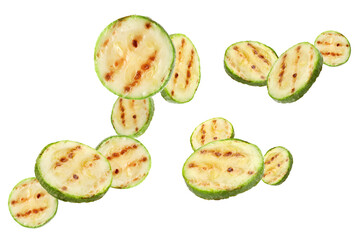 Grilled pieces of zucchini flying in air on white background