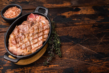 Roast pork tender loin steak, neck meat. wooden background. top view
