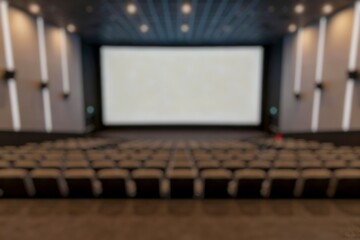 Blurry Cinema auditorium with white blank screen and white seats.
