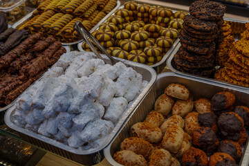 Assorted trays of traditional cookies in a bakery display