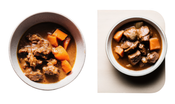 Beef stew with carrots in a bowl on a light background  