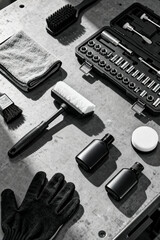 Automotive service tools and supplies arranged neatly on a workbench in a garage setting for efficient vehicle maintenance