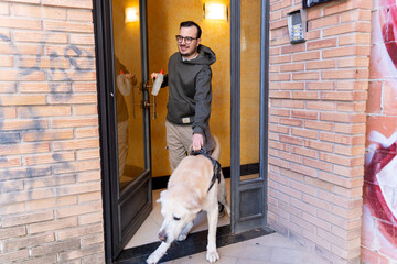Freelance programmer walking dog from apartment building