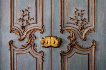 New York City, NY.. Blue Rococo designed door with beautiful carved details. 