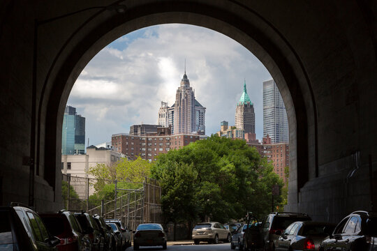 New York City, NY, USA. View of lower downtown Manhattan through the arch of a tunnel.
