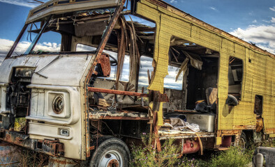 Deteriorated RV motorhome was once a vacation road trip family camper now wasting away