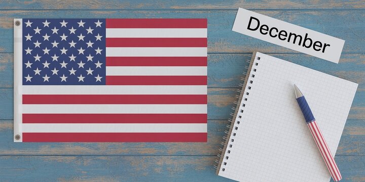 Overhead flat lay of a blank notebook and pencil next to a folded American flag on rustic blue wooden table for December planning or events.